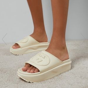 Gucci off-white rubber slides